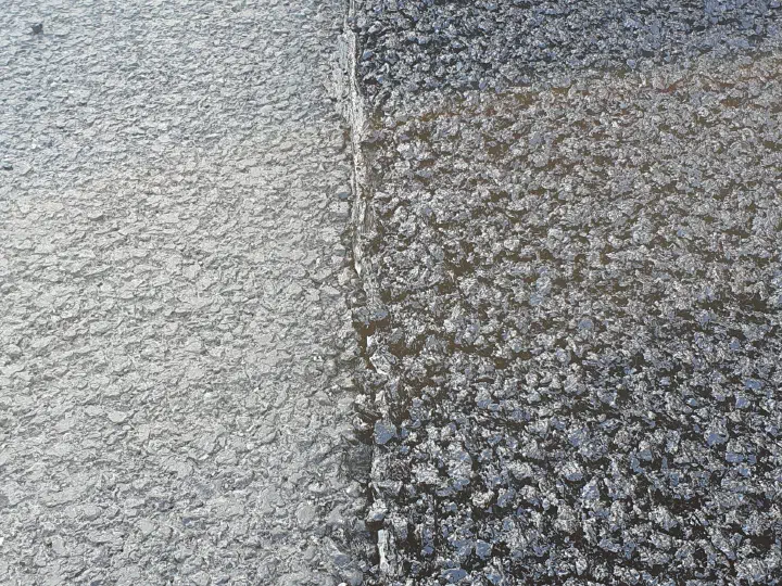 A close view of the lane connection beside the paver.